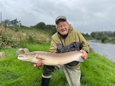 Gentleman with August salmon on river slaney